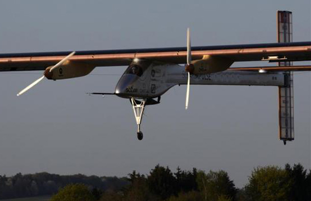 Test pilot Markus Scherdel of Germany attempts to land in the Solar Impulse's solar-powered HB-SIA prototype airplane during a test flight at Payerne airport. (REUTERS)