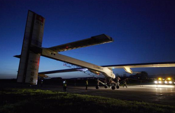 Staff members move the Solar Impulse HB-SIA solar-powered prototype airplane on the tarmac before a test flight at Payerne airport, Switzerland April 11, 2011. The Solar Impulse HB-SIA, which has 12,000 solar cells built into its 64.3-meter (193-foot) wings, is a prototype for an aircraft that its creators hope will carry out its first circumnavigation of the globe from 2012. (REUTERS)