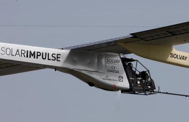 German test pilot Markus Scherdel steers the solar-powered Solar Impulse HB-SIA prototype airplane during his first flight over Payerne. (REUTERS)