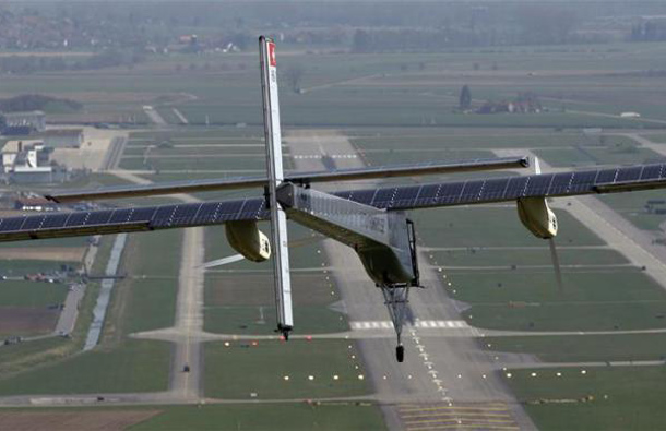 German test pilot Markus Scherdel steers the solar-powered Solar Impulse HB-SIA prototype airplane during his first flight over Payerne air base. (REUTERS)