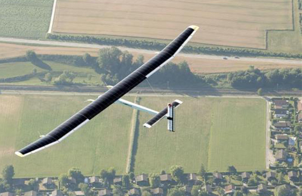 Solar Impulse's Chief Executive Officer and pilot Andre Borschberg flies in the solar-powered HB-SIA prototype airplane during its first successful night flight attempt at Payerne airport, Switzerland. (REUTERS)