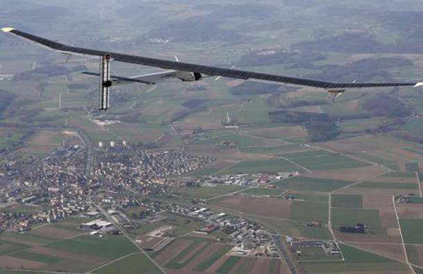 German test pilot Markus Scherdel, steers the solar-powered Solar Impulse HB-SIA prototype airplane during his first flight over Payerne, Switzerland. (REUTERS)