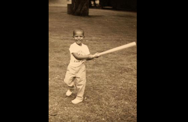 Barack Obama swinging a baseball bat as a child in an undated family snapshot. (REUTERS)