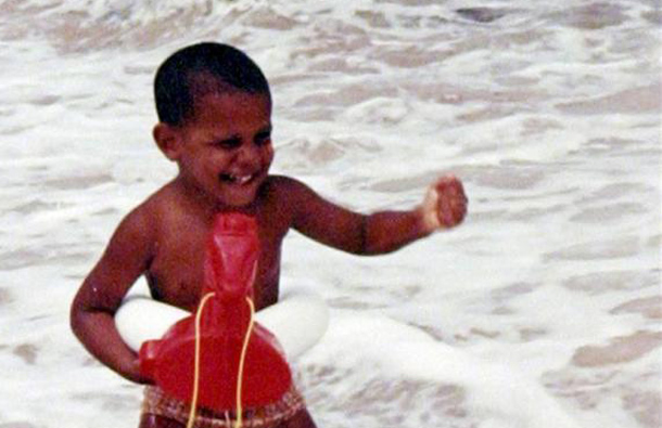 Barack Obama playing in the ocean as a child in an family snapshot from the 1960's. (REUTERS)