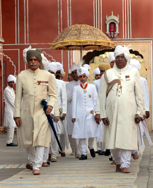 Maharaja of Jaipur, Kumar Padmanabh Singh (centre) is surrounded by his entourage at his coronation ceremony at the city palace in Jaipur on April 28, 2011. Padmanabh Singh's grandfather, polo-playing Sawai Bhawani Singh, was hailed as "the last Maharaja of Jaipur" when he died two weeks ago because he had come to the throne shortly before all royal privileges were swiped out. Like all Indian royal titles, the Maharaja of Jaipur is no longer legally recognised after independence from Britain in 1947 and government reforms in the 1970s.  (AFP)