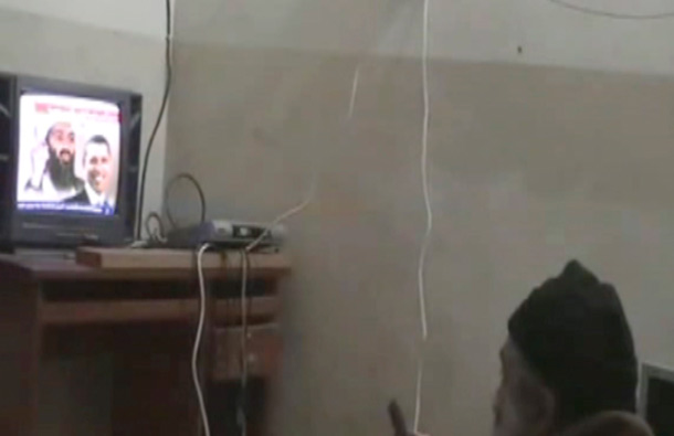 A man the American government says is Osama bin Laden watches television in this undated image taken from video provided by the US Department of Defense. The videos show bin Laden watching himself on television and rehearsing for terrorist videos. (AP)