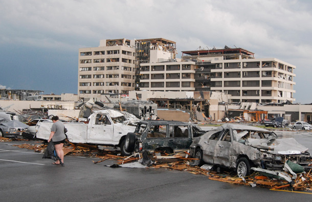 Damaged vehicles litter the parking lot of St. John's Hospital in Joplin, Mo, after a tornado hit the southwest Missouri city. A massive tornado blasted its way across southwestern Missouri, flattening several blocks of homes and businesses in Joplin and leaving residents frantically scrambling through the wreckage. (AP)