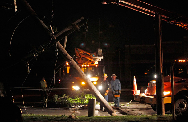 Utility workers clear downed power lines near the St. John's hospital, after a devastating tornado hit Joplin, Missouri. Tornadoes tore through parts of the US Midwest, killing at least 30 people in the Missouri town of Joplin and causing one death in Minneapolis as well as causing extensive property damage. (REUTERS)