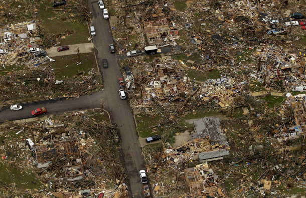 A destroyed neighborhood is seen in Joplin, Mo. A large tornado moved through much of the city Sunday, damaging a hospital and hundreds of homes and businesses. (AP)