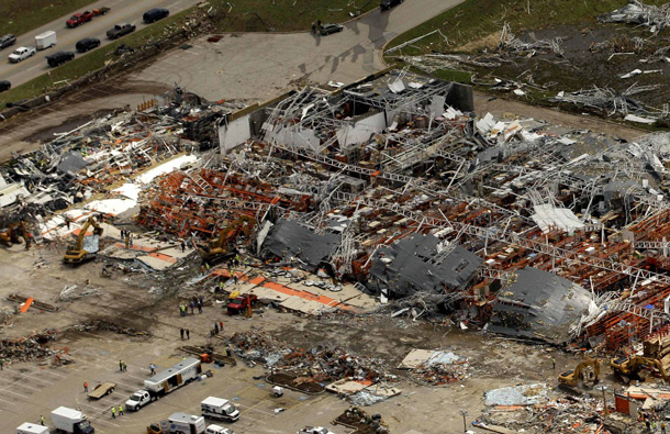 A large tornado moved through much of the city Sunday, damaging a hospital and hundreds of homes and businesses. (AP)