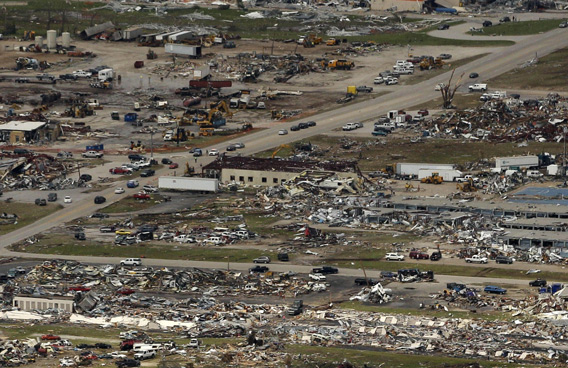 A destroyed neighborhood is seen in Joplin, Mo. A large tornado moved through much of the city Sunday, damaging a hospital and hundreds of homes and businesses. (AP)