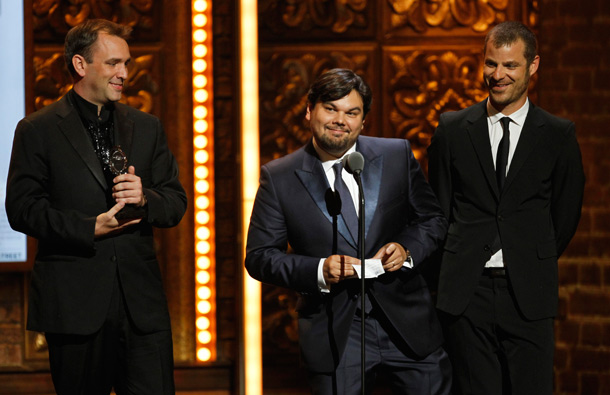 From left, Trey Parker, Robert Lopez and Matt Stone accept the award for Best Book of a Musical for "The Book of Mormon" during the 65th annual Tony Awards in New York. (AP)