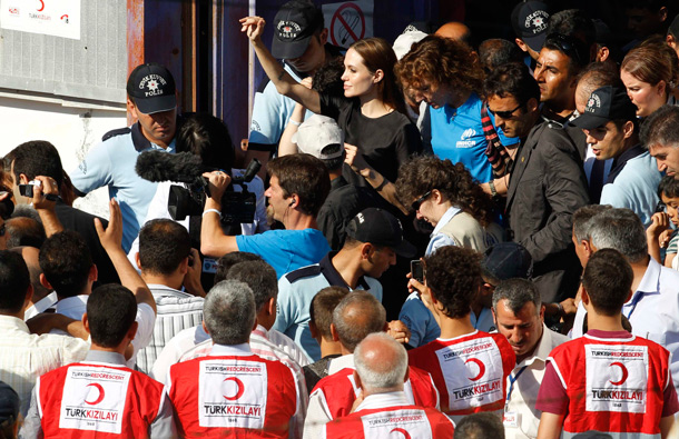 United Nations High Commissioner for Refugees (UNHCR) Goodwill Ambassador Angelina Jolie (C) visits a refugee camp in the southern Turkish town of Altinozu in Hatay province. Angelina Jolie is in Hatay province to visit Syrian refugees. (REUTERS)