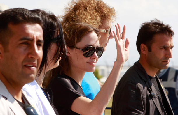 United Nations High Commissioner for Refugees (UNHCR) Goodwill Ambassador Angelina Jolie greets media members as she leaves from Hatay airport, southern Turkey. Angelina Jolie is in Hatay province to visit Syrian refugees. (REUTERS)