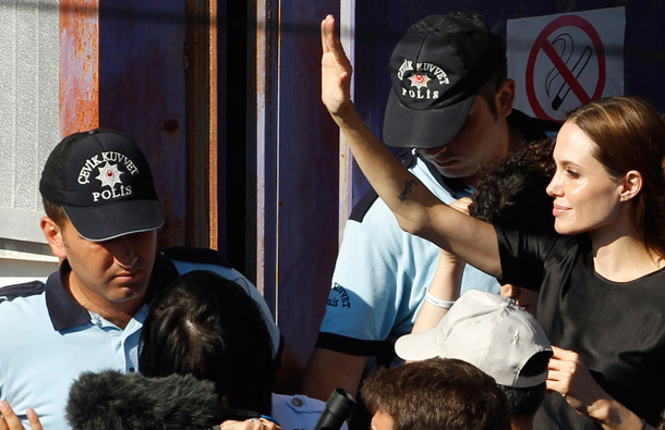 United Nations High Commissioner for Refugees (UNHCR) Goodwill Ambassador Angelina Jolie (R) greets Syrian refugees as she visits a refugee camp in the southern Turkish town of Altinozu in Hatay province. (REUTERS)