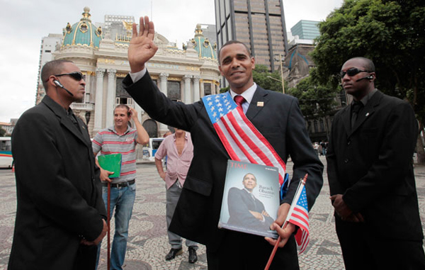 US President Barack Obama impersonator, Rinaldo Americo, poses in Cinelandia Square in Rio de Janeiro. (REUTERS)