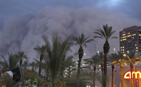  A dust storm known as a "habub" rolls into downtown Phoenix on Tuesday night, July 5, 2011, bringing strong winds and low visibility. Habubs are part of Arizona's annual monsoon season, which is now in full swing. (AP)