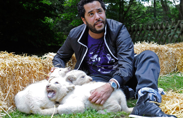 Adel Tawil, singer with the German band "Ich&Ich", is pictured with six-week-old white lion cubs "Adel", "Rosi" and "Jasmin" during a christening ceremony in a safari-park in Hodenhagen, Lower-Saxony. (REUTERS)