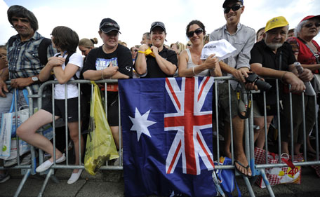 Journalists crowd around Johnny Hoogerland of The Netherlands, wearing the best climber's dotted jersey, prior to the start of the 10th stage of the Tour de France cycling race over 158 kilometers (98.2 miles) starting in Aurillac and finishing in Carmaux, south central France, Tuesday July 12, 2011. Hoogerland was victim of a crash after a vehicle hit riders in the breakaway group during the 9th stage. (AP)