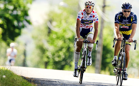 DCM Vacansoleil Dutch rider Johnny Hoogerland wears the polka dot jersey while cycling with his father Cees near Aurillac, on the first rest day of the Tour de France cycling race, in Aurillac, southern France, on July 11, 2011. Dutchman Johnny Hoogerland had 33 stitches inserted to close deep gashes in his leg after he was hit by a car on the ninth stage of the Tour de France, his team said Monday. (AFP)