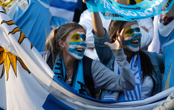 Uruguay soccer fans shout before a Copa America quarterfinal match between Argentina and Uruguay in Santa Fe, Argentina. (AP)