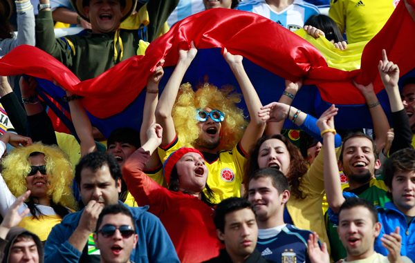 Colombia's soccer fans cheer during a Copa America quarterfinal soccer match against Peru  in Cordoba, Argentina. (AP)