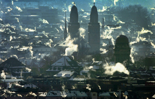 Zurich, Switzerland: Smoke billows from chimneys over the rooftops of downtown Zurich after the coldest night of this winter. (REUTERS)