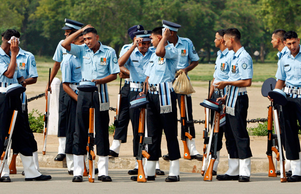 Indian Air Force personnel relax after a ceremony to pay homage to the Indian soldiers who died in the 1999 Kargil conflict between India and Pakistan across the disputed Kashmir region at the India Gate war memorial in New Delhi, India. Top Indian and Pakistani officials met in New Delhi for peace talks against the backdrop of a recent terror attack that killed 20 people in India's financial capital. (AP)