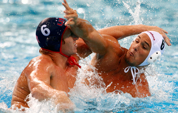 Hungary's Norbert Hosnyanszky (R) fights Brian Alexander of the U.S. during their men's water polo quarter-final match at the 14th FINA World Championships in Shanghai. (REUTERS)