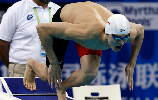 China's Sun Yang jumps off the block at the start of the men's 800m freestyle heats at the 14th FINA World Championships in Shanghai. (REUTERS)