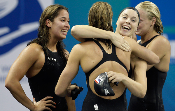 The Dutch team celebrate after winning the women's 4x100m Freestyle Relay at the FINA Swimming World Championships in Shanghai, China. (AP)