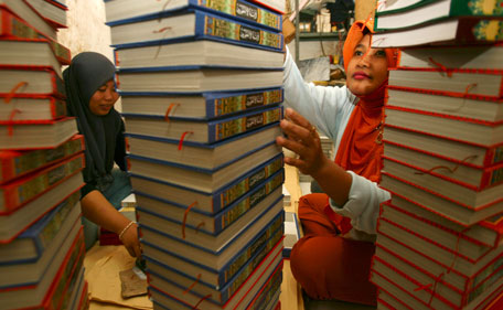 Workers count of printed copes of the Koran at a printing press near Sunan Ampel mosque in Surabaya, Indonesia East Java province, July 27, 2011. The demand for the Koran usually increase from 10 thousand to 20 thousand books ahead of the month of Ramadan, according to Suyanto, the owner of the printing press. (REUTERS)