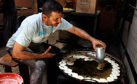 An Iraqi baker prepares sweets in preparation for the Muslim fasting month of Ramadan, which is set to begin in August, in Basra, 340 miles (550 kilometers) southeast of Baghdad, Iraq, Thursday, July 28, 2011. (AP)