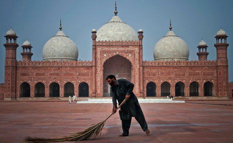 A Pakistani worker cleans the floor of a historical Badshahi mosque in preparation for the upcoming Ramadan in Lahore, Pakistan Sunday, July 31, 2011. Ramadan, the Muslim's holy fasting month, is expected to officially begin Monday or Tuesday in Pakistan, though the timing depends on the alignment of the moon. Muslims usually increase their religious activities during the Ramadan. (AP)