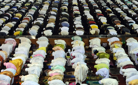 Muslim men and women pray on the first night of Ramadan on July 31, 2011. Like millions of Muslim around the world, Indonesians celebrate the holy month of Ramadan by abstaining from eating and drinking, smoking as well as sexual activities from dawn to dusk. (AFP)