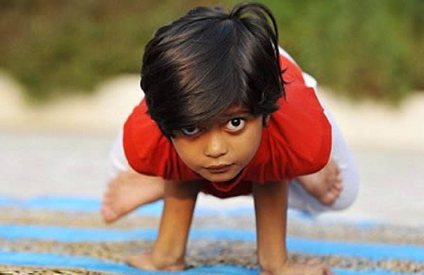 World's Youngest Yoga Teacher (6): At just six, Shruti Pandey is the youngest yoga trainer in the world. The bendy youngster has been teaching adults at an ashram, in northern India, for the last two years. Her trainer, Hari Chetan, 67, set up the ashram 35 years ago and as soon as little Shruti became one of his students, as a tiny four-year old, he spotted her talents. Now she starts her classes at 5.30 am every morning, at Brahmanand Saraswati Dham, in the Jhunsi town, dressed in white leggings and a red t-shirt surrounded by 30 eager pupils ranging from businessmen, teachers, housewives to pensioners. Shruti said: "It feels good when people follow my instructions, I feel like a real teacher."