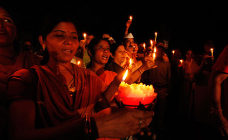 Supporters of Indian rights activist Anna Hazare light candles as they stage a demonstration in his support in Allahabad, India, Monday, Aug. 15, 2011. Hazare announced he will resume his hunger strike on Tuesday to pressure the government into enacting stronger legislation for an anti-corruption watchdog. (AP)