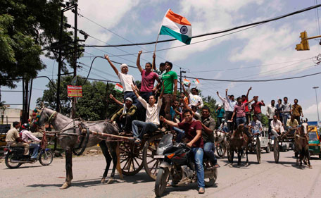 Supporters of Indian anti corruption activist Anna Hazare in horse carts take out a rally in his support in Allahabad, India, Tuesday, Aug 16, 2011. Hazare arrested Tuesday for planning a public hunger strike began his fast behind bars as his supporters held protests across the country, with thousands detained by police.(AP)