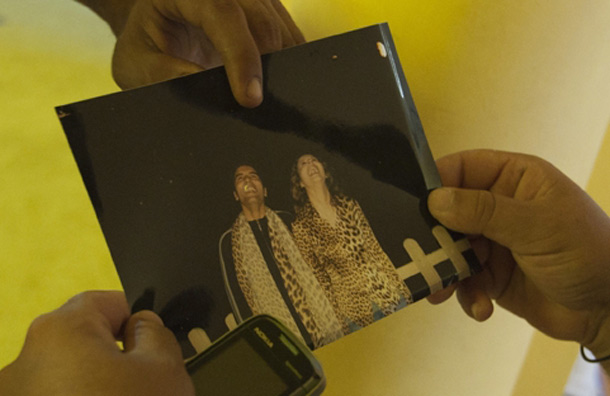 Rebel fighters look over personal photos belonging to Aisha Gaddafi. (AP)