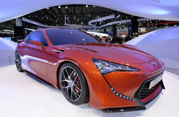 The Toyota FT-86 II concept car is displayed on the booth of Japanese carmaker Toyota during a preparation day before the opening of the international car show IAA in Frankfurt/M, western Germany. Clouds may be gathering over the global economy, but auto makers are revving up to try and dispel any gloom with nearly 90 new models at the world's biggest motor show, the IAA, running from September 15 to 25, 2011. (AFP)