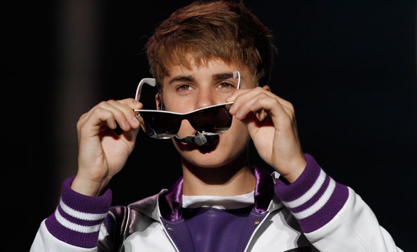 Pop sensation Justin Bieber removes his sunglasses during his "My World Tour" concert performance at Foro Sol in Mexico City, Saturday Oct 1, 2011. (AP)