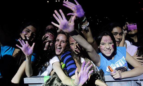 Fans react as Canadian pop singer Justin Bieber performs during his  "My World Tour" concert at the Foro Sol in Mexico City October 1, 2011. (REUTERS)