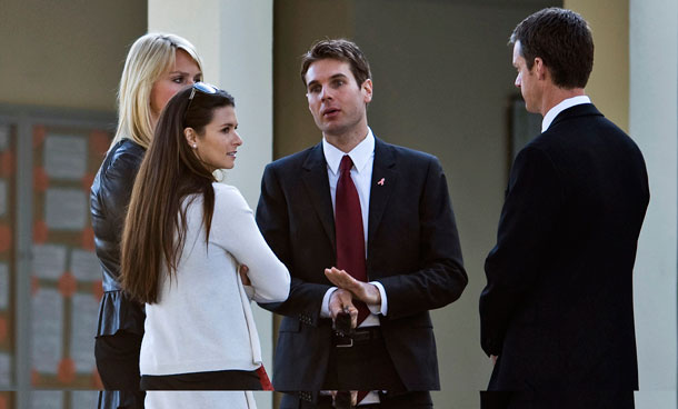 IndyCar drivers Danica Patrick (2nd L) and Will Power (C) talk outside the First Presbyterian Church of St Petersburg before a funeral service for fellow driver Dan Wheldon in St. Petersburg, Florida October 22, 2011.  (REUTERS)