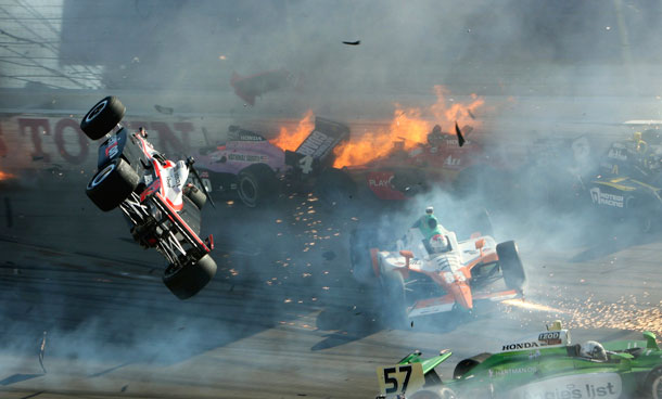 The race car of driver Will Power (L) goes airborne during the IZOD IndyCar World Championship race at the Las Vegas Motor Speedway in Las Vegas, Nevada October 16, 2011. British IndyCar driver Dan Wheldon died from injuries sustained in an horrific crash at the Las Vegas Motor Speedway on Sunday, race organizers said.(REUTERS)