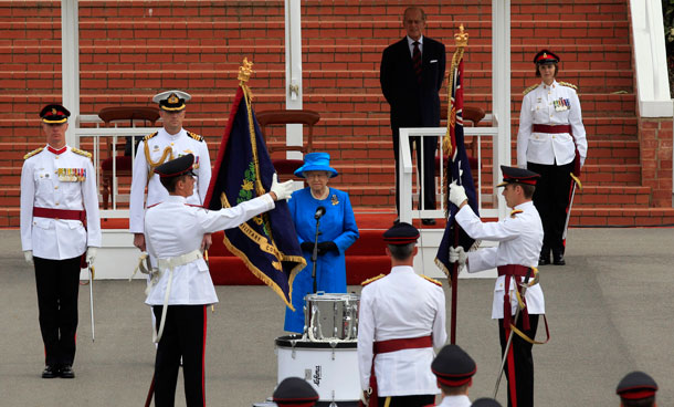 Britain's Queen Elizabeth II waves from the catamaran 'Pure Adrenalin' during the royal boat tour along the Brisbane River on October 24, 2011. Tens of thousands of well-wishers packed the banks of the Brisbane River, engorged just nine months ago with floodwaters that submerged 30,000 homes in Australia's third-largest city, to catch a glimpse of the queen.  (AFP)