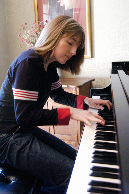 In this March 17, 2005, photo Hillary Adams, the daughter of Aransas County Court-at-Law Judge William Adams, practices the piano at her home in Rockport, Texas. Williams Adams told a Corpus Christi television station the video secretly recorded in 2004 looks “worse than it is.” The video shows Adams violently whipping his daughter, Hillary, in the legs more than a dozen times, while she screams and refuses to turn over on a bed to be beaten (AP)