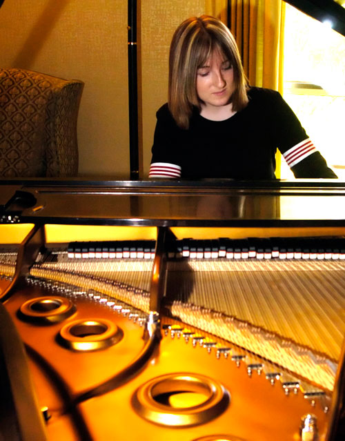 In this March 17, 2005, photo Hillary Adams, the daughter of Aransas County Court-at-Law Judge William Adams, practices the piano at her home in Rockport, Texas. Williams Adams told a Corpus Christi television station the video secretly recorded in 2004 looks “worse than it is.” The video shows Adams violently whipping his daughter, Hillary, in the legs more than a dozen times, while she screams and refuses to turn over on a bed to be beaten (AP)