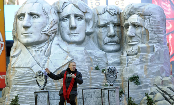 Singer Neil Diamond on the Mount Rushmore float as it makes its way down Seventh Avenue  through Times Square  during the 85th Macy's Thanksgiving Day Parade in New York November 24, 2011. The parade, which has been an annual event since 1924, is expected to draw an estimated 3 million spectators and 50 million television viewers, according the retail store. (AFP)