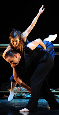 Japanese dancer and choreographer Motoko Hirayama (L) and Romanian contemporary dancer Razvan Mazilu (R) performs during the premiere of their “Requiem. You don’t know anything about me” ballet show at the Odeon Theater in Bucharest on November 25, 2011. (AFP)