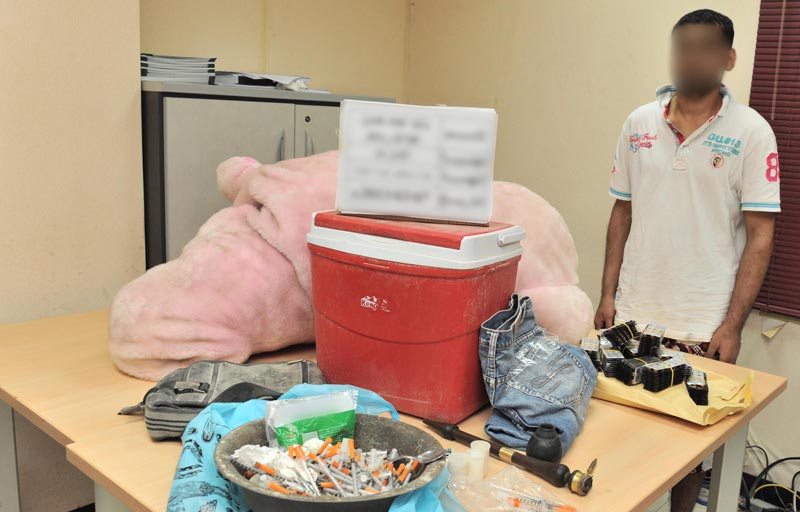 The arrested youth with the drugs found in his possession.